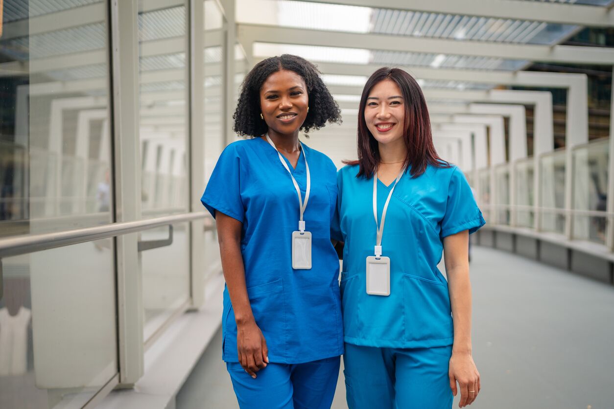 Women in medical uniforms celebrating friendship in Sydney, Australia during a sunny day